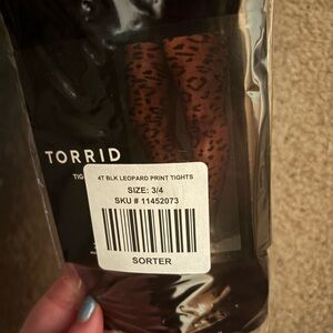 NWT Torrid size 3/4 Black leopard print tights still in packaging never opened.